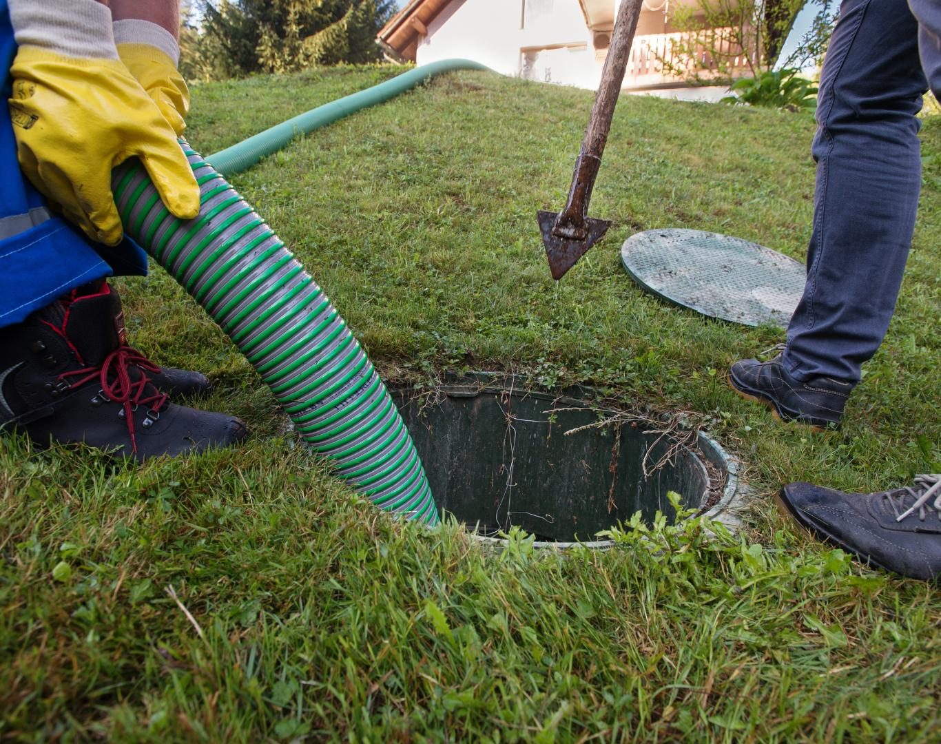 Crew operating vacuum truck for Septic cleaning in Gunbarrel, CO at a residential home