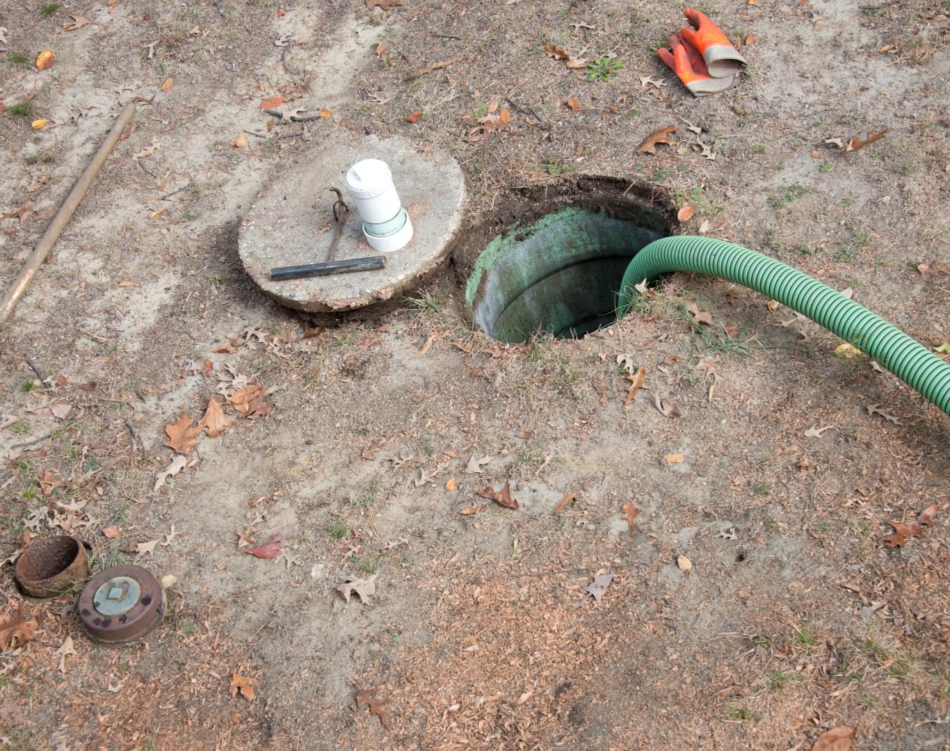 Technician completing Septic cleaning near me for a business in downtown Boulder