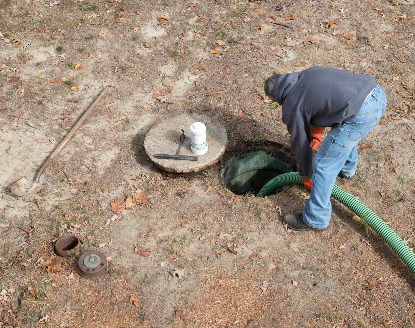 Technician performing Septic pumping near me for a commercial business in Gunbarrel