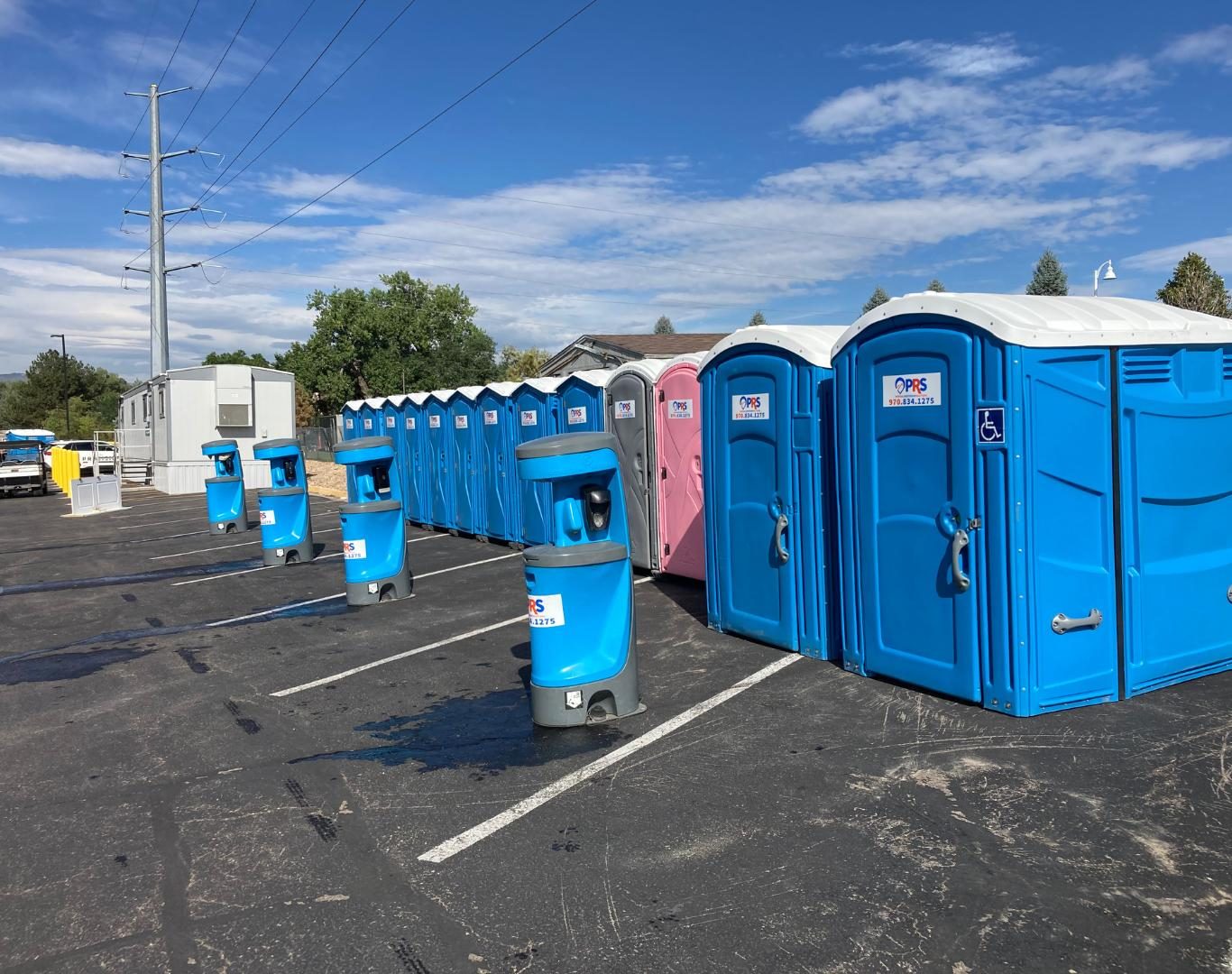 Units lined up for delivery of Portable toilets in Greeley, CO at a music festival