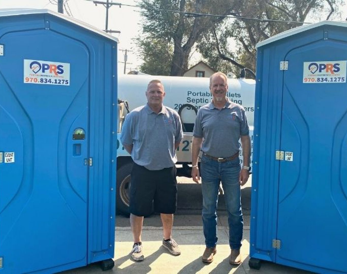 Units stationed for Porta potty rentals near me during a neighborhood celebration